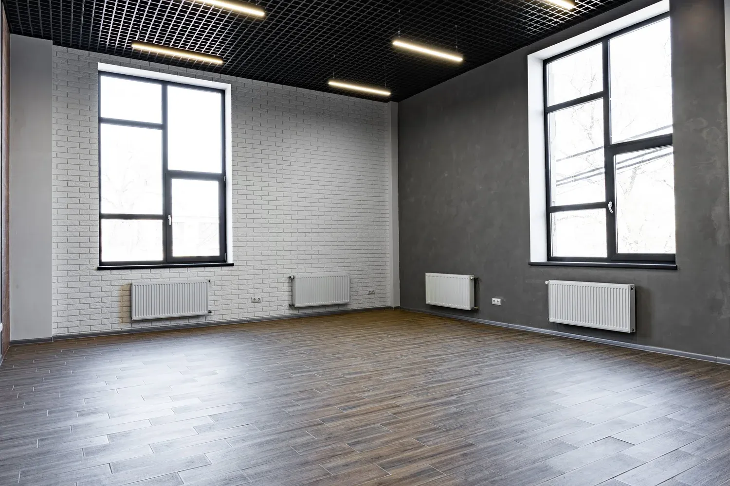 Empty open-space office with large windows